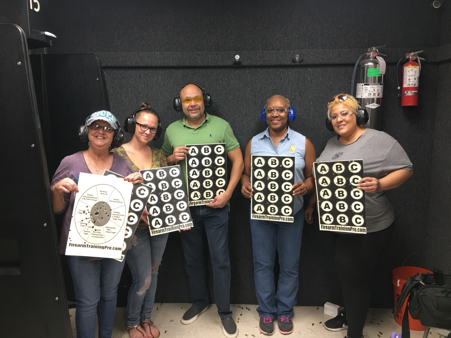 Students holding completed targets